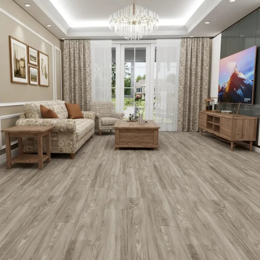 A modern living room with light gray wood-look vinyl or laminate flooring, featuring a beige sofa, wooden coffee table, and a large TV on a console against a dark accent wall.