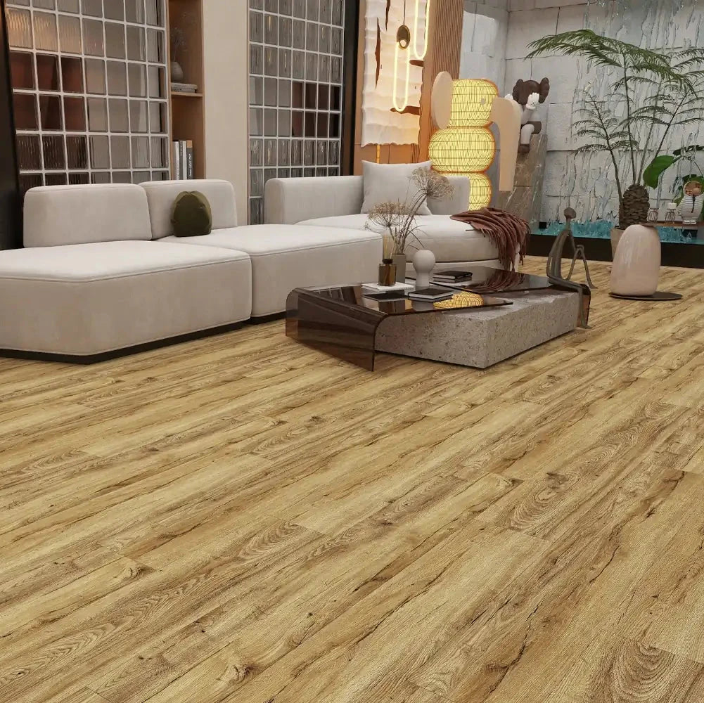 Light brown wood-look laminate or vinyl flooring shown installed in a modern living room setting with a white sectional sofa, wooden shelves, and a coffee table.